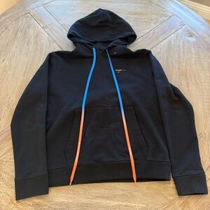 Off-White Black Garment with Orange Accent